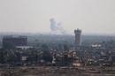 Smoke rises in Egypt's North Sinai as seen from the border of southern Gaza Strip with Egypt