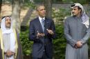 President Barack Obama, center, with Kuwaiti Emir Sheikh Sabah Al-Ahmad Al-Sabah, left, and Qatar's Emir Sheikh Tamim bin Hamad Al-Thani, right, as he makes a statement to members of the media after meeting with Gulf Cooperation Council leaders and delegations at Camp David in Maryland, Thursday, May 14, 2015. Obama and leaders from six Gulf nations are trying to work through tensions sparked by the U.S. bid for a nuclear deal with Iran, a pursuit that has put regional partners on edge. Obama is seeking to reassure the Gulf leaders that the U.S. overtures to Iran will not come at the expense of commitments to their security. (AP Photo/Pablo Martinez Monsivais)