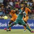 Ivory Coast's Tiote tackles Nigeria's Emenike during their African Nations Cup (AFCON 2013) quarter final soccer match in Rustenburg