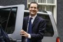 The Latest: Cameron reappoints key figures to Cabinet