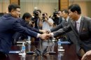 Head of the South Korean working-level delegation Suh Ho shakes hands with his North Korean counterpart Park Chol-su before their talks at the Tongilgak on the North Korean side of the truce village of Panmunjom