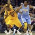 Cleveland Cavaliers Gee gets the ball knocked away by Denver Nuggets Iguodala during the first quarter of their NBA basketball game in Cleveland