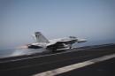 An F/A-18C Hornet takes off for Iraq from the flight deck of the US navy aircraft carrier USS George H.W. Bush on August 15, 2014 in the Gulf