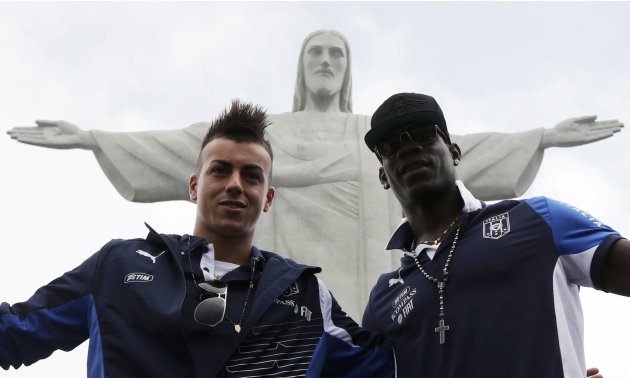 Italy's national soccer team players Balotelli and El Shaarawy pose during a visit to the Christ the Redeemer statue in Rio de Janeiro
