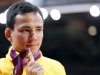 Brazil's Felipe Kitadai celebrates with his bronze B medal after awards ceremony for men's -60kg final judo match at London 2012 Olympic Games