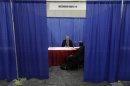 A military veteran receives a job interview in Detroit, Tuesday, June 26, 2012. Thousands of veterans are in Detroit this week for a job fair, open house, and small business conference. (AP Photo/Paul Sancya)
