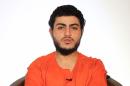 An image grab taken March 10, 2015 from a video reportedly released by the Islamic State group through Al-Furqan Media shows a youth identifying himself as Mohammed Said Ismail Musallam and addressing the camera in Arabic at an undisclosed location