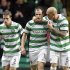 Celtic's Anthony Stokes (C) celebrates after scoring a goal against Rennes with teammate Daniel Majstorovic (R) in 2011