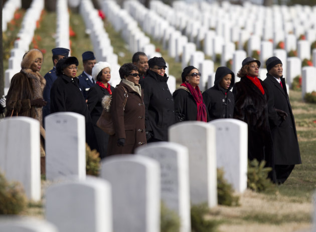 Friends and family of former Tuskegee airman, retired Lt. Col. Luke Weathers arrive for burial services at Arlington National Cemetery in Arlington, Va., Friday, Jan. 20, 2012. (AP Photo/Evan Vucci)