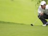 Casey of England lines his putt on the 15th green during the European Masters golf tournament in Crans-Montana