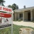 In this July 13, 2011 photo, a pending sale sign is displayed in front of a home in Little Rock. Ark. The number of people who signed contracts to buy homes fell in July, further evidence that the depressed housing market remains a drag on the economy. (AP Photo/Danny Johnston)