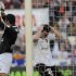 Valencia's forward Paco Alcacer (R) reacts after missing a goal