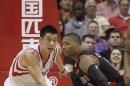 Rockets' Lin and Trailblazers' Lillard chase a loose ball during their NBA basketball game in Houston