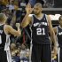 Spurs' Duncan celebrates with teammate Parker and Leonard during overtime in Game 3 of their NBA Western Conference final playoff basketball series in Memphis