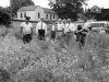 In this summer, 1952, photo hemp plants growing wild on a lot in downtown Louisville, Ky., are killed with chemical spray. Efforts to restore the crop that decades ago was a major industry in Kentucky appear to be growing despite the defeat of another legalization effort in the state’s 2012  General Assembly. The tall, leafy plant was outlawed because of its similarity to marijuana, but supporters argue it’s nearly impossible to get high by smoking hemp. (AP Photo/Louisville Courier-Journal) NO SALES, NO ARCHIVE, MAGS OUT