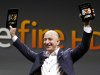 Jeff Bezos, CEO and founder of Amazon, holds the new at the introduction of the new Amazon Kindle Fire HD in Santa Monica, Calif., Thursday, Sept. 6, 2012. (AP Photo/Reed Saxon)