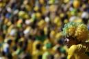 A Brazil soccer fan watches his team's World Cup round of 16 match against Chile at Mineirao Stadium in Belo Horizonte, Brazil, Saturday, June 28, 2014. Brazil won the match 3-2 on penalties after the match ended 1-1. (AP Photo/Petr David Josek)