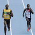 Jamaica's Usain Bolt and Britain's Christian Malcolm, right, compete in a Men's 200m heat at the World Athletics Championships in Daegu, South Korea, Friday, Sept. 2, 2011. (AP Photo/Martin Meissner)