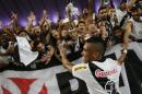 Vasco's Madson celebrates with fans after winning the Rio de Janeiro state championship against Botafogo 2-1 at the Maracana stadium in Rio de Janeiro, Brazil, Sunday, May 3, 2015. (AP Photo/Felipe Dana)