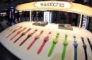 Swatch watches are displayed in front of a shop at the central station in Zurich