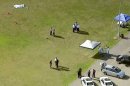 In this image taken from video and provided by WABC-TV in New York, investigators stand near a remote controlled toy helicopter, center, that apparently struck and killed a 19-year-old man, top left, Thursday, Sept. 5, 2013, at Calvert Vaux Park in the Brooklyn borough of New York. It wasn't immediately clear how the accident occurred and police didn't immediately say if the man was operating the remote control helicopter he was struck by. (AP Photo/WABC-TV) MANDATORY CREDIT, NO SALES
