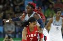 United States' Maya Moore (7) drives around France's Isabelle Yacoubou during a semifinal round basketball game at the 2016 Summer Olympics in Rio de Janeiro, Brazil, Thursday, Aug. 18, 2016. (AP Photo/Charlie Neibergall)