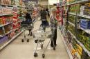 Customers shop for groceries in a supermarket in London
