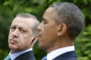 Turkish Prime Minister Erdogan listens to U.S. President Obama during joint news conference at the White House in Washington
