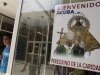 Man walks by poster of Pope Benedict XVI in Havana