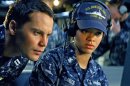 In this film publicity image released by Universal Pictures, Taylor Kitsch, left, and Rihanna are shown in a scene from 