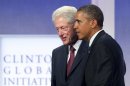 FILE - This Sept. 24, 2013 file photo shows former President Bill Clinton and President Barack Obama at the Clinton Global Initiative in New York. On its face, the annual Clinton Global Initiative meeting here provided a platform for Bill, Hillary and Chelsea Clinton to announce a series of financial commitments from corporations, non-governmental organizations and philanthropists to address intractable problems around the globe. Perhaps more than any other year, however, the New York gathering of Clinton loyalists and luminaries offered a vivid look at the past, present and future of one of America's most dominant political families. (AP Photo/Mark Lennihan, File)