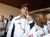 Anton Ferdinand gestures as QPR team members arrive in Malaysia for a friendly