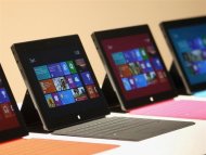 New Surface tablet computers with keyboards are displayed at its unveiling by Microsoft in Los Angeles