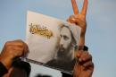 An Iraqi man on January 3, 2016 in Baghdad holds a portrait of Shiite Muslim cleric Nimr al-Nimr during a demonstration against his execution by Saudi authorities
