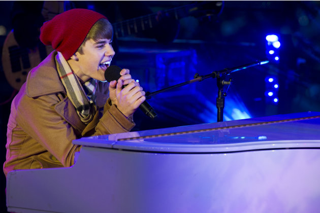 Justin Bieber performs in Times Square during New Year's Eve celebrations, Saturday, Dec. 31, 2011, in New York. (AP Photo/Charles Sykes)