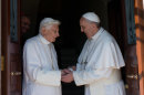 RETRANSMISSION OF OSS101 TO PROVIDE DIFFERENT CROP -- In this photo provided by the Vatican newspaper L'Osservatore Romano, Pope emeritus Benedict XVI, left, is welcomed by Pope Francis as he returns at the Vatican from the pontifical summer residence of Castel Gandolfo, 35 km South-Est from Rome, Thursday, May 2, 2013. Emeritus Pope Benedict XVI came home on Thursday to a new house and a new pope, as an unprecedented era begins of a retired pontiff living side-by-side with a reigning one inside the Vatican gardens. In background is archbishop George Gaenswein, prefect of the papal household. (AP Photo/Osservatore Romano, HO)