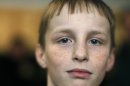 Artyom Savelyev, a 9-year-old Russian boy, is in a foster home in Tomilino, outside Moscow, Russia, Thursday, April 12, 2012. Savelyev is a Russian boy whose adoptive mother sent him on a plane alone from the U.S. back to Moscow in April 2010. The Russian children's rights ombudsman says he wants an American woman who sent her young adopted son back to Russia to testify in a Moscow court. (AP Photo/Misha Japaridze)