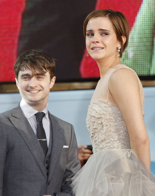 British actress Emma Watson, right, sheds a tear alongside Daniel Radcliffe, after they arrive in Trafalgar Square, in central London, for the World Premiere of Harry Potter and The Deathly Hallows: P
