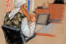 In this photo of a sketch by courtroom artist Janet Hamlin and reviewed by the U.S. Department of Defense, Khalid Sheikh Mohammed sits at a defense table wearing a camouflage vest in front of military judge U.S. Army Col. James Pohl, right, during the third day of the Military Commissions pretrial hearing against the five Guantanamo prisoners accused of the Sept. 11 terrorist attacks at the Guantanamo Bay U.S. Naval Base in Cuba, Wednesday, Oct. 17, 2012. Khalid Sheikh Mohammed, who has told authorities he was the mastermind of the Sept. 11 hijacking plot, wore the woodland-style camouflage vest for the first time Wednesday, a clothing choice previously denied because of fears it might disrupt the court. (AP Photo/Janet Hamlin, Pool)