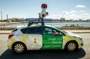 A Google Street View vehicle collects imagery for Google Maps while driving down a street in Calais, northern France, on July 29, 2015