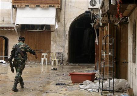 A Free Syrian Army fighter walks in the old city of Aleppo February 11, 2013. Picture taken February 11, 2013. REUTERS/Aref Heretani