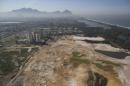 FILE - This June 27, 2014 file photo shows an aerial view of the Rio 2016 Olympic golf course under construction in Rio de Janeiro, Brazil. The public prosecutor's office is taking on the city government and the golf course developer in a lawsuit that contends environmental rules were breached in building the course. Public prosecutor Marcus Leal told The Associated Press on Wednesday, Oct. 15, 2014 that the two sides are in a 30-day negotiation period aimed at resolving their differences. (AP Photo/Leo Correa, File)