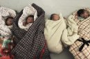 In this photo taken Wednesday, Jan. 25, 2012, newborn babies wait to be bathed at a hospital in Zouping county in east China's Shandong province. On Friday, June 15, 2012, China suspended three officials and apologized to a woman who was forced to undergo an abortion seven months into her pregnancy in a case that sparked a public uproar after graphic photos of the mother and her dead baby were circulated online. (AP Photo) CHINA OUT
