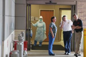 Health care workers wait for the arrival of a possible&nbsp;&hellip;