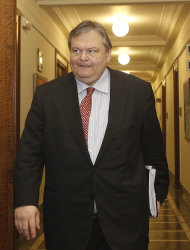 <p>               Greek Finance Minister Evangelos Venizelos arrives for a cabinet meeting at the Greek Parliament in Athens, Thursday, Dec. 22, 2011. Negotiations with banks for a massive Greek bond swap deal are "going well" and a framework agreement is expected in early January, officials in the country's coalition government said. (AP Photo/Thanassis Stavrakis)