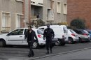 A policeman patrols in front of the five-storey apartment building where special forces police staged the assault on the gunman Mohamed Merah, in Toulouse