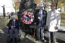 Three of the four surviving members of the 1942 Tokyo raid led by Lt. Col. Jimmy Doolittle, left to right, David Thatcher, Edward Saylor, and Richard Cole, pose next to a monument marking the raid, Saturday, Nov. 9, 2013, outside the National Museum for the US Air Force in Dayton, Ohio. The fourth surviving member, Robert Hite, was unable to travel to the ceremonies. (AP Photo/Al Behrman)