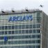 The letter "B" of the signage on the Barclays headquarters in Canary Wharf is hoisted up the side of the building in London