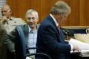 Millionaire Robert Durst (C) sits in State District court with his attorney Dick DeGuerin November 10, 2003 at the Galveston County Courthouse in Galveston, Texas, where he was charged for the murder and mutilation of his neighbor