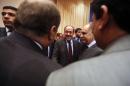 Iraqi Prime Minister Nuri al-Maliki (C) talks with Kurdish MPs as he arrives for the first session of the new parliament on July 1, 2014 in the capital Baghdad